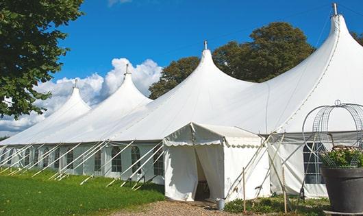 a line of portable restrooms in a shaded area, offering a comfortable experience for users in Santa Nella